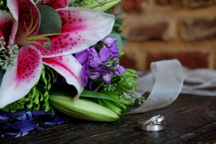 Our wedding rings with my bouquet . . . Photo credit to Emily Sibitzky of Triskay Photography
