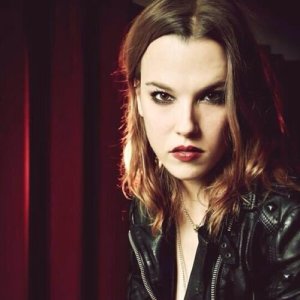 Lzzy Hale is definitely a role model for me in some ways. She's gorgeous & feminine in some ways but also a total badass.